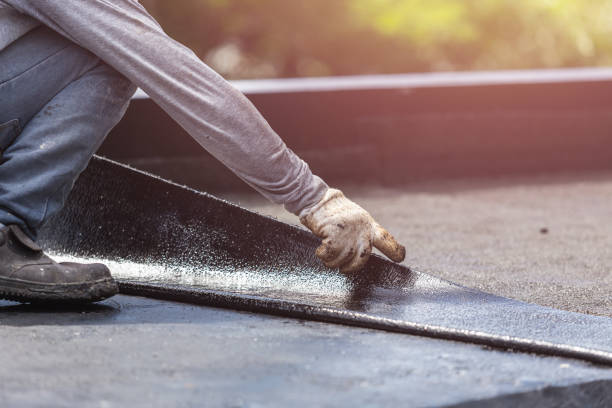 Professional Basement Waterproofing technician working in Bowie, MD